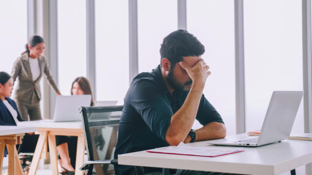 Tired employee because of poor work life balance